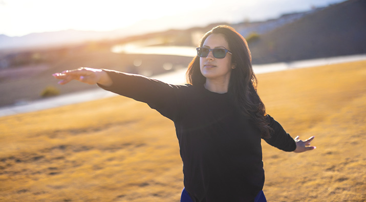 Woman wearing SunSync Light-Reactive Lenses