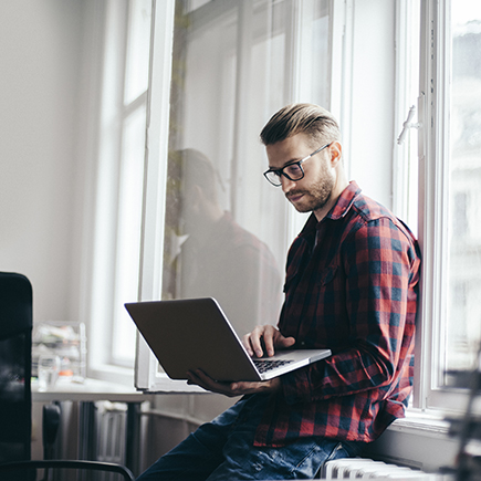 Man at work using laptop