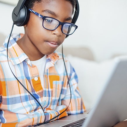 Young boy using laptop