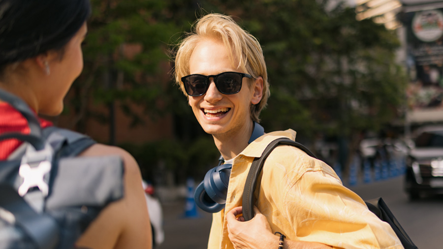 Young adult wearing SunSync Light-Reactive Lenses